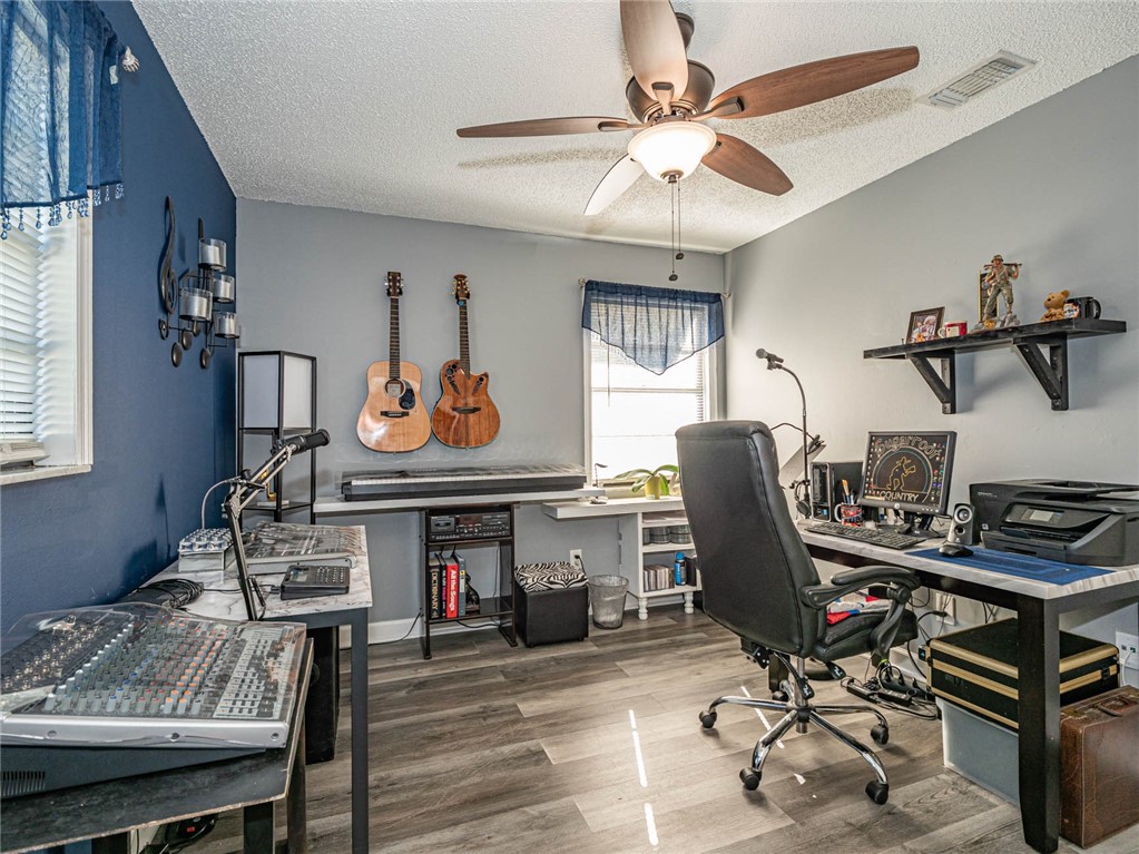 438 Columbus Street Sebastian, FL 32958 - Photo 14 of 32 a work room with furniture and windows