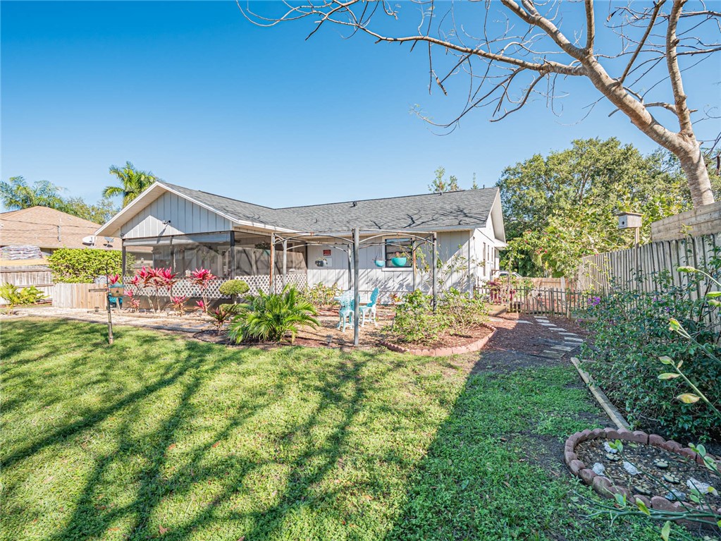 438 Columbus Street Sebastian, FL 32958 - Photo 20 of 32 a front view of a house with garden