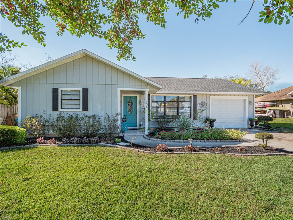 438 Columbus Street Sebastian, FL 32958 - Photo 2 of 32 a front view of house with yard and outdoor seating