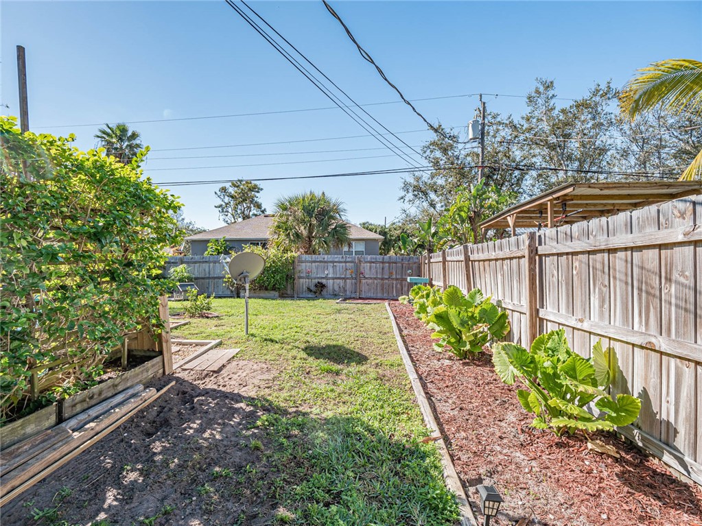 438 Columbus Street Sebastian, FL 32958 - Photo 22 of 32 a view of a backyard with plants