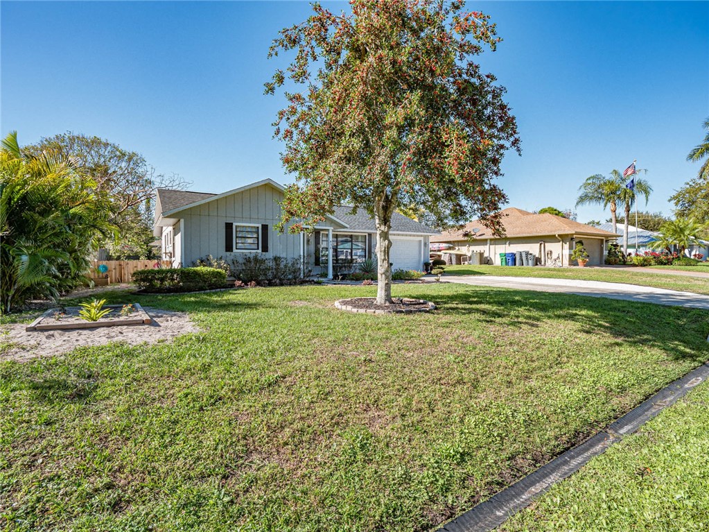 438 Columbus Street Sebastian, FL 32958 - Photo 23 of 32 a front view of a house with a yard