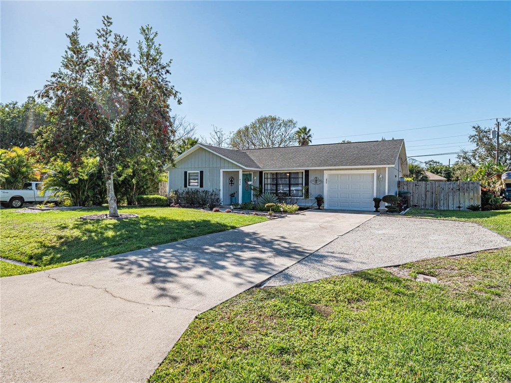 438 Columbus Street Sebastian, FL 32958 - Photo 24 of 32 a house with garden in front of it