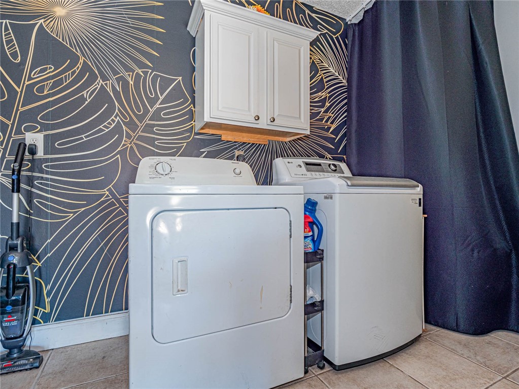 438 Columbus Street Sebastian, FL 32958 - Photo 27 of 32 a utility room with dryer and washer