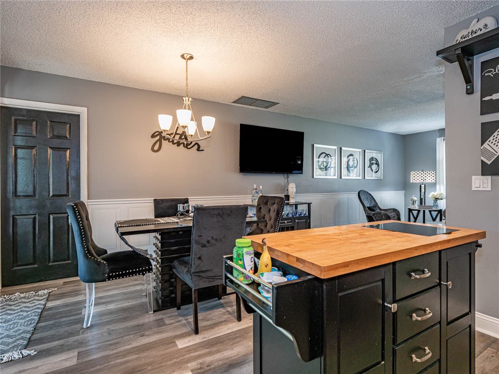 438 Columbus Street Sebastian, FL 32958 - Photo 8 of 32 a view of a dining room with furniture and wooden floor