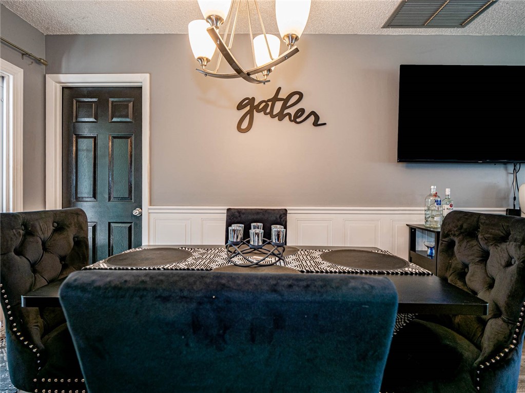 438 Columbus Street Sebastian, FL 32958 - Photo 10 of 32 a bedroom with a bed and flat screen tv