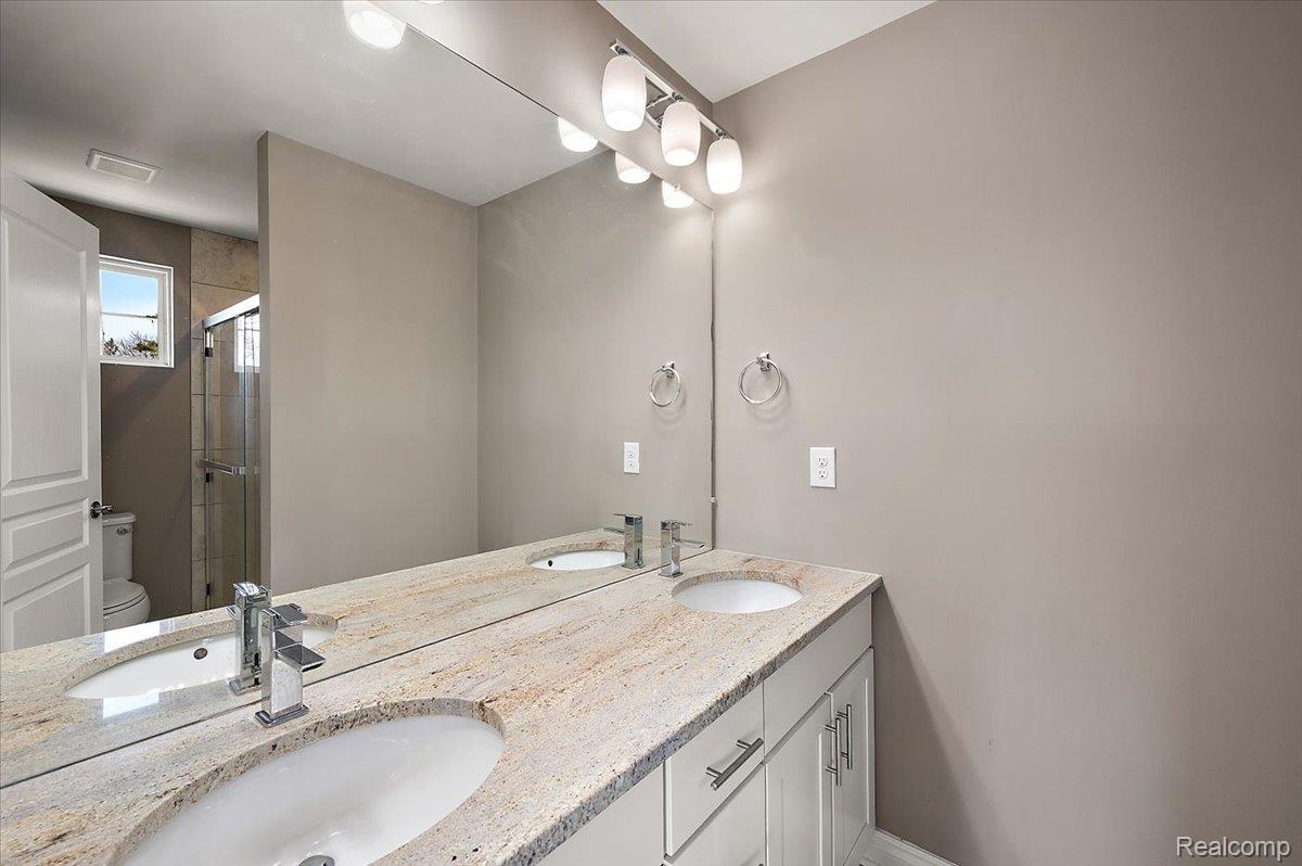 2877 Hartwick Drive Rochester, MI 48307 - Photo 35 of 44 Full bath with a shower stall and double vanity