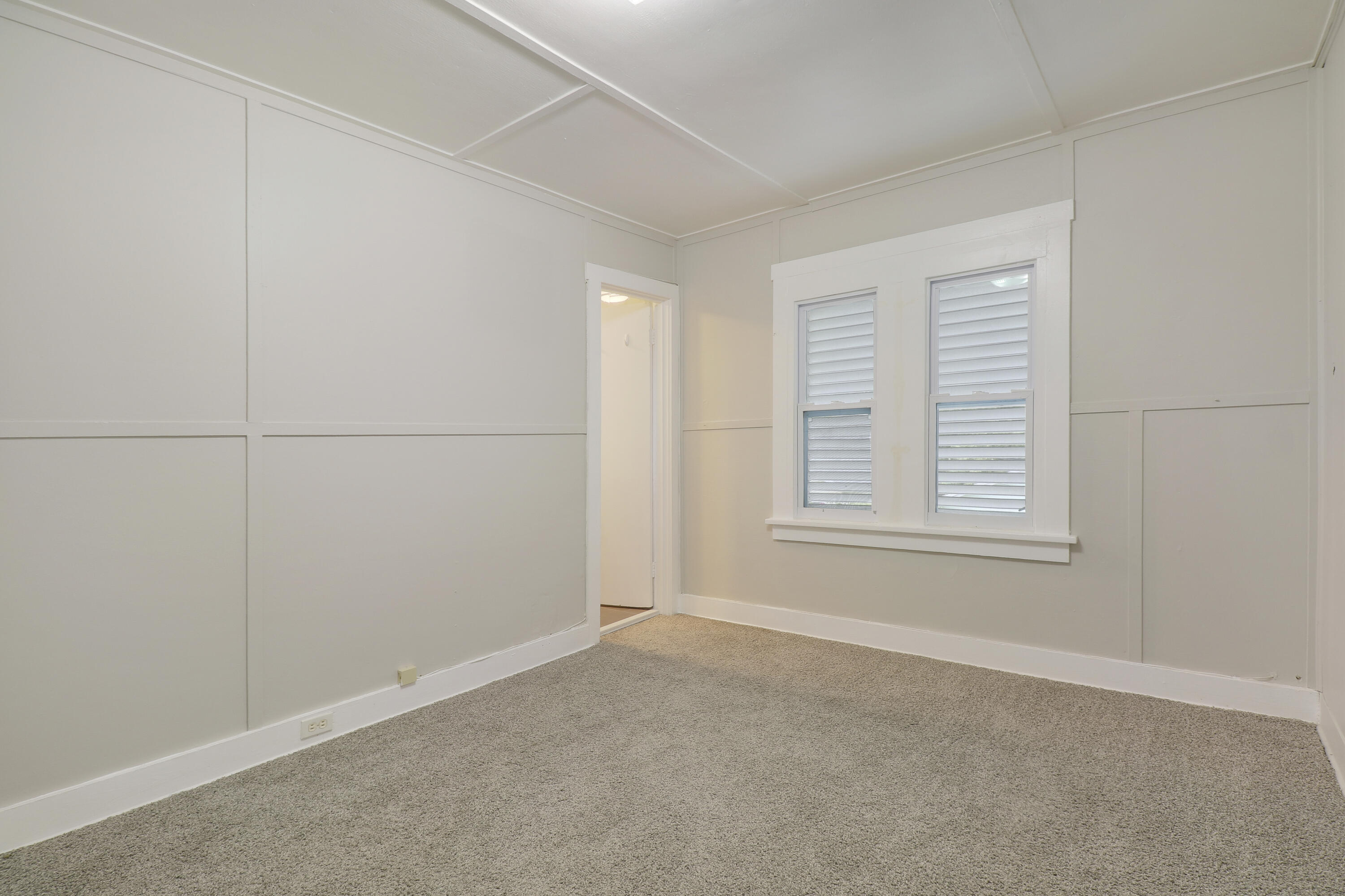 1118 North J Street, Unit C Lake Worth Beach, FL 33460 - Photo 11 of 13 an empty room with windows
