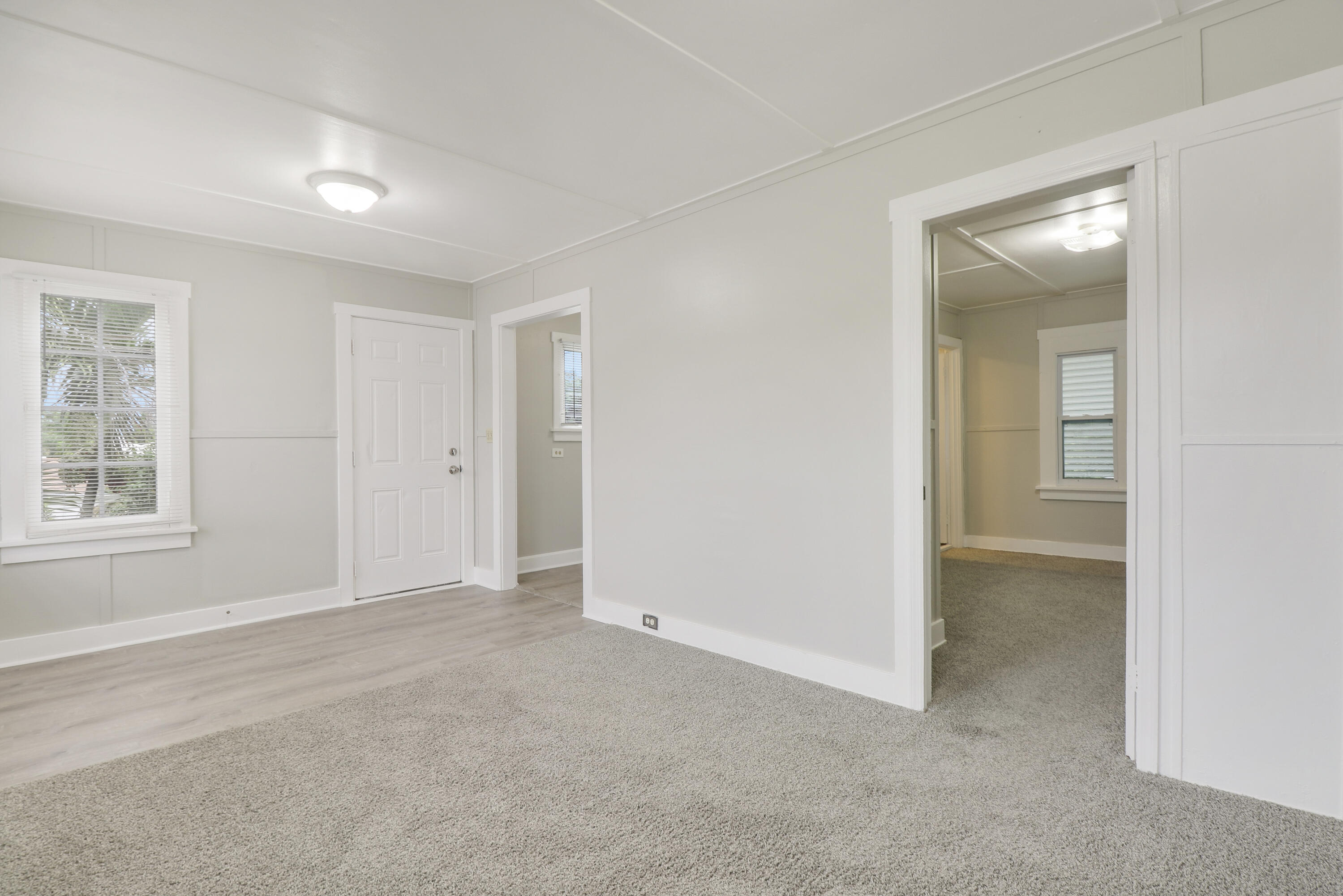 1118 North J Street, Unit C Lake Worth Beach, FL 33460 - Photo 5 of 13 an empty room with windows and closet