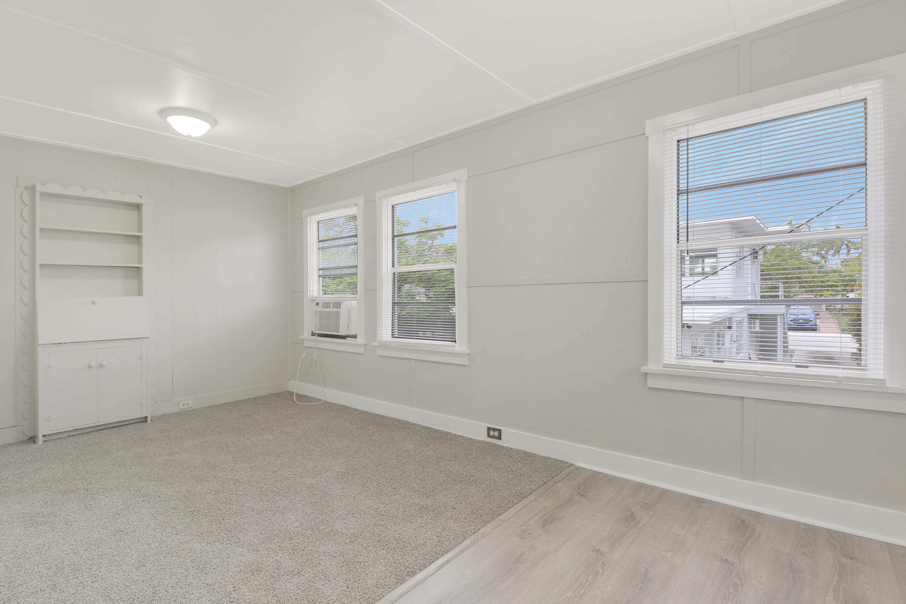1118 North J Street, Unit C Lake Worth Beach, FL 33460 - Photo 7 of 13 an empty room with windows