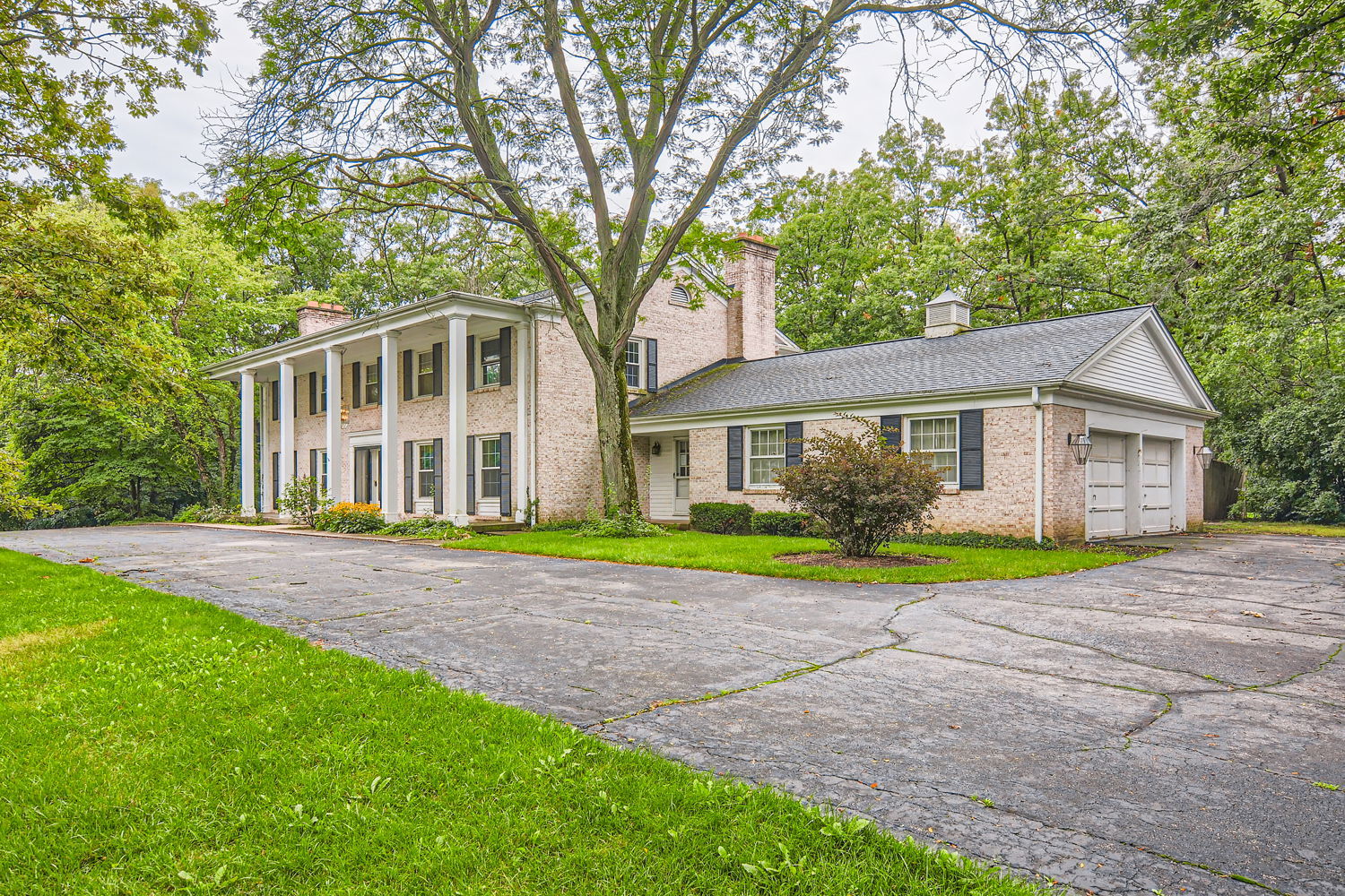 680 Rockefeller Road Lake Forest, IL 60045 - Photo 1 of 40 a front view of a house with a yard and trees