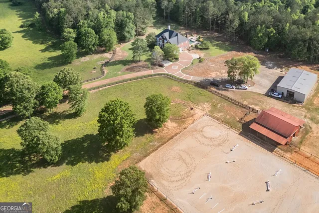 an aerial view of a house with a garden and yard