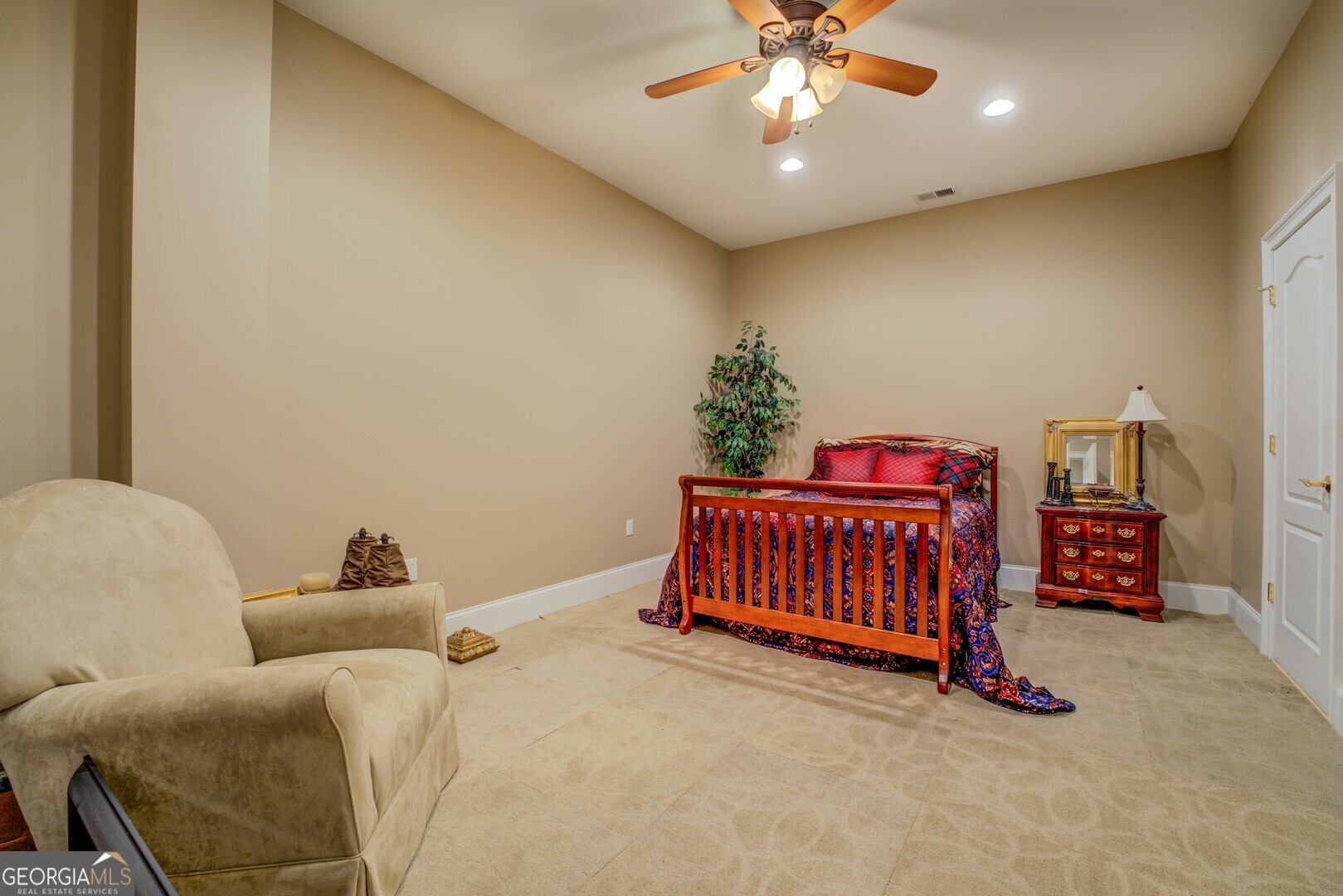 20207 State Highway 11 Monticello, GA 31064 - Photo 118 of 159 a bedroom with a bed and a chandelier