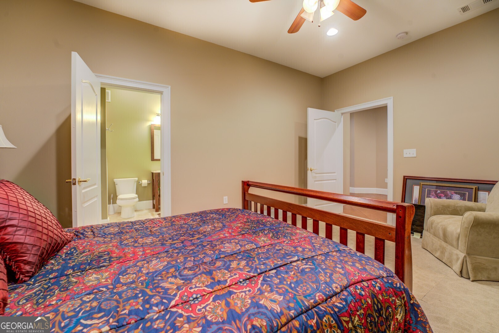 20207 State Highway 11 Monticello, GA 31064 - Photo 119 of 159 a bedroom with a bed and a chandelier