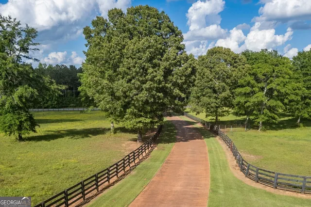 a living room with furniture flat screen tv and a fireplace