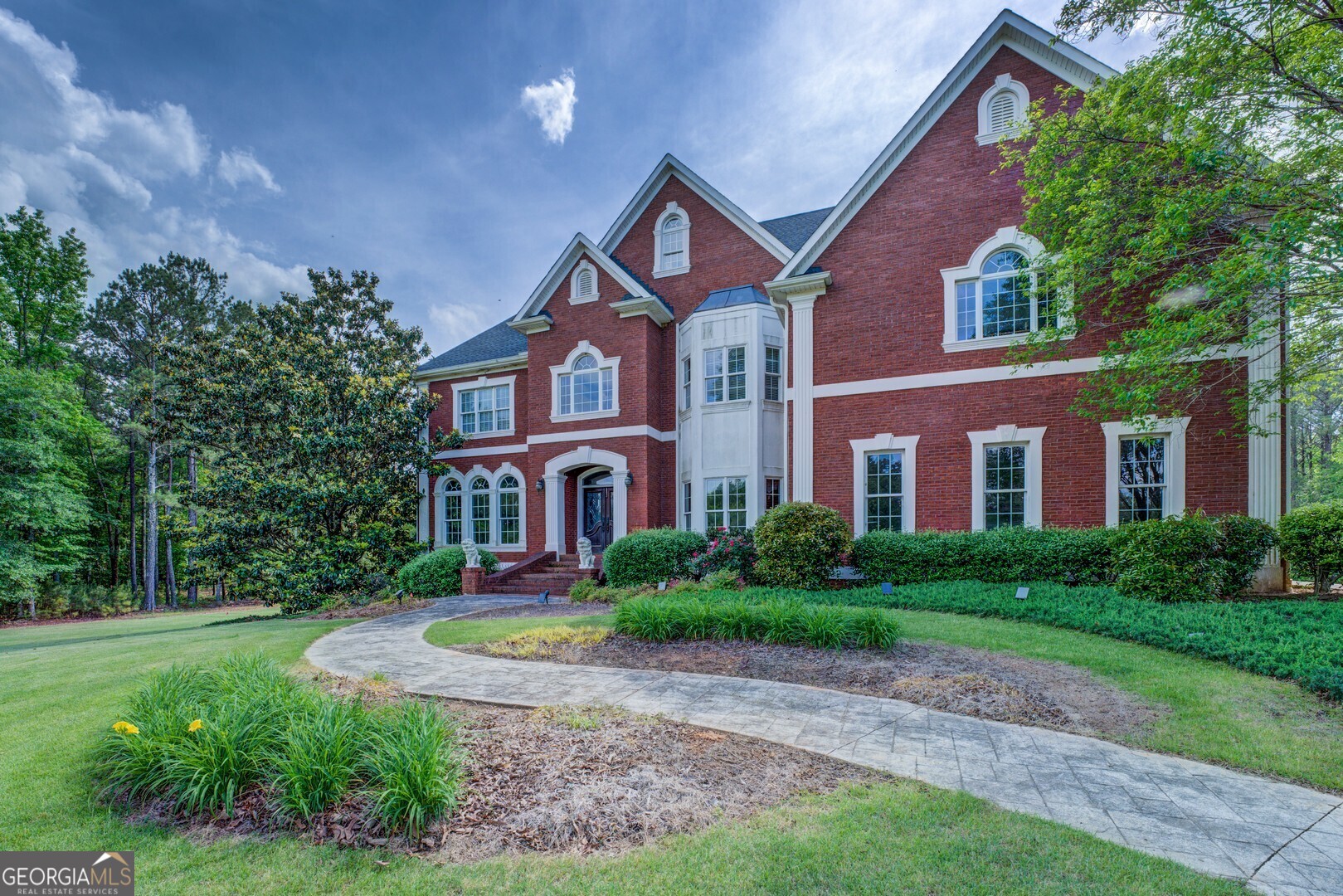 20207 State Highway 11 Monticello, GA 31064 - Photo 18 of 159 a front view of a house with yard and green space
