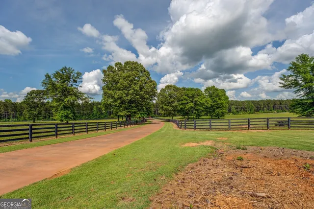 a kitchen with stainless steel appliances granite countertop a refrigerator and a stove
