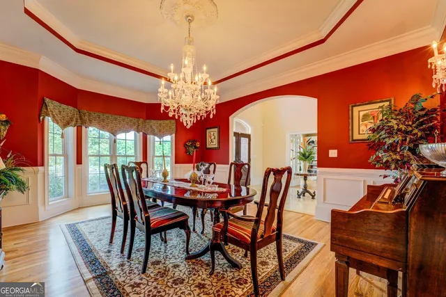a living room with furniture a fireplace and a table