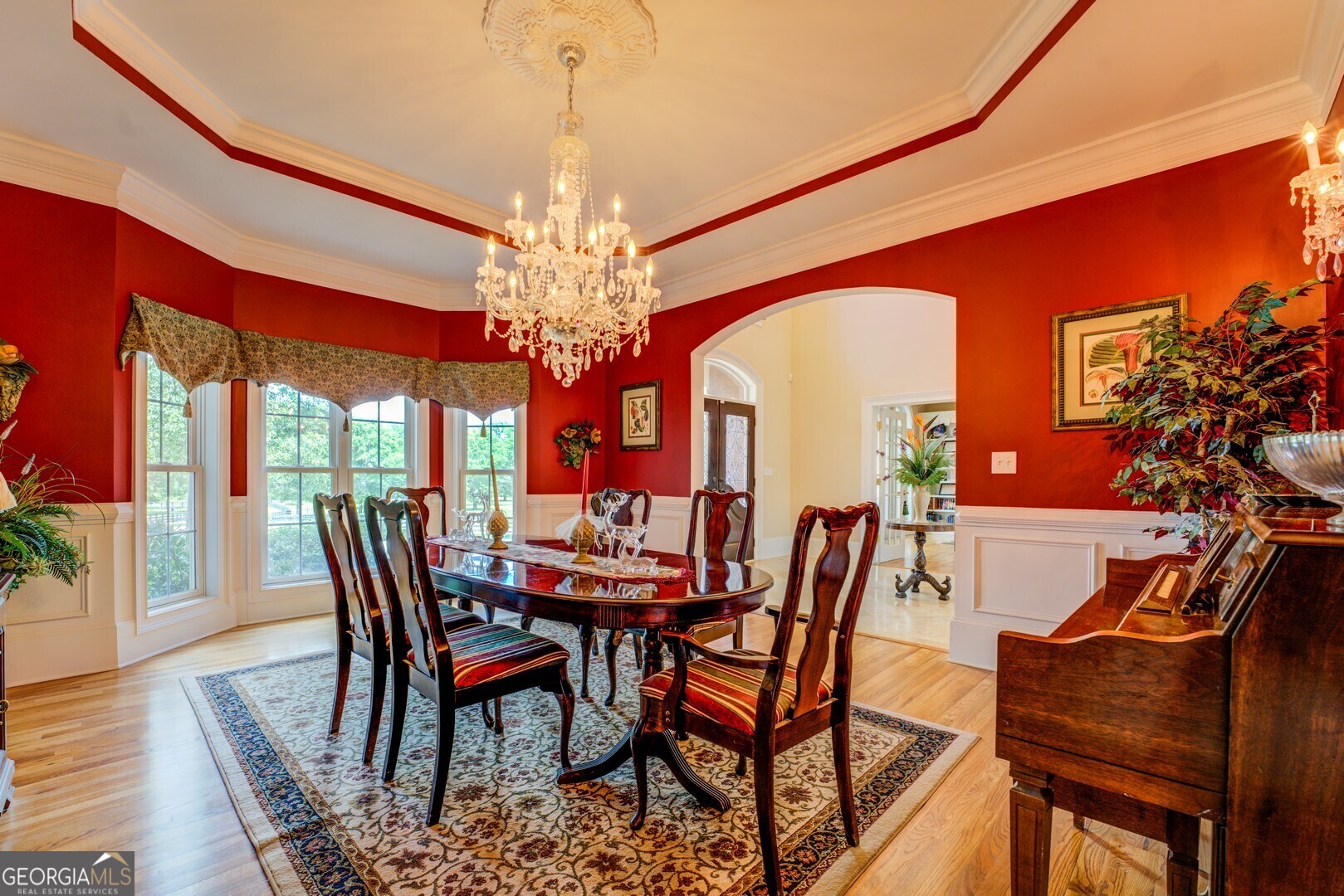 20207 State Highway 11 Monticello, GA 31064 - Photo 36 of 159 a view of a dining room with furniture a chandelier and wooden floor