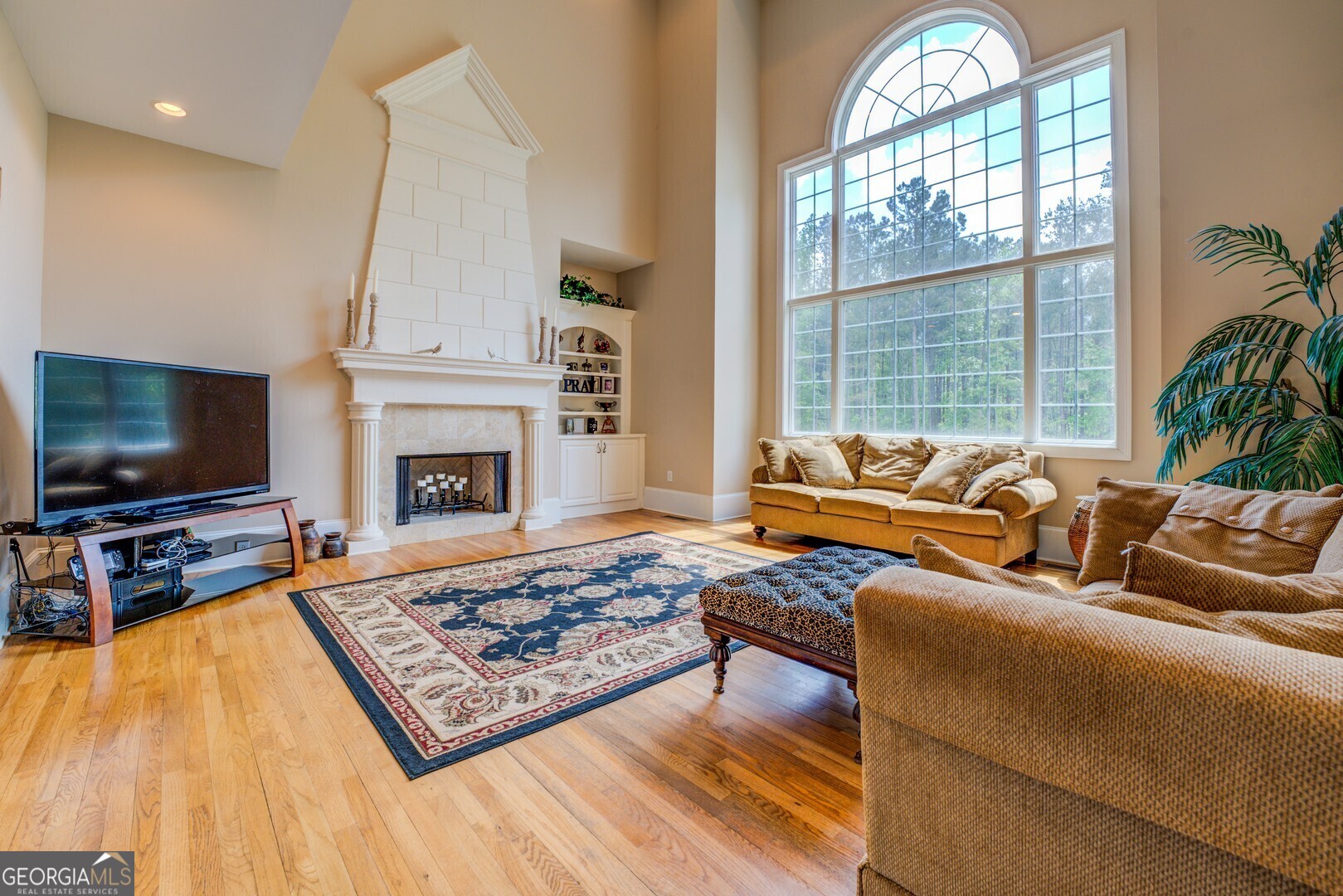 20207 State Highway 11 Monticello, GA 31064 - Photo 40 of 159 a living room with furniture flat screen tv and a fireplace
