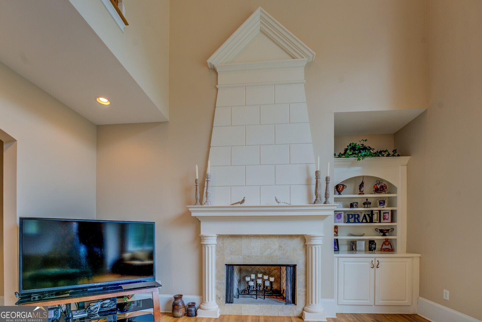 20207 State Highway 11 Monticello, GA 31064 - Photo 41 of 159 a living room with fireplace and a flat screen tv