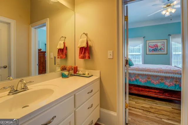 a view of a field with trees in the background