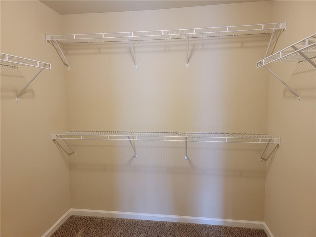 2707 Morgan Glen Road Northeast Buford, GA 30519 - Photo 14 of 24 a view of a room with racks on the wall