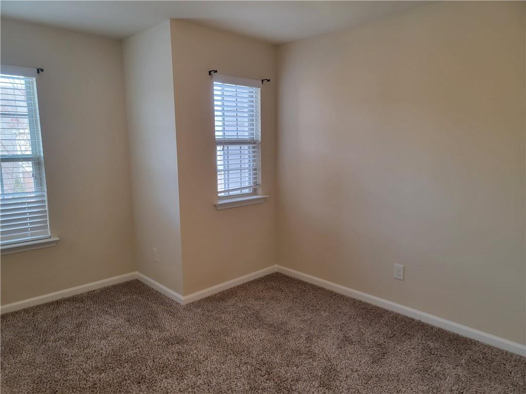 2707 Morgan Glen Road Northeast Buford, GA 30519 - Photo 21 of 24 an empty room with windows