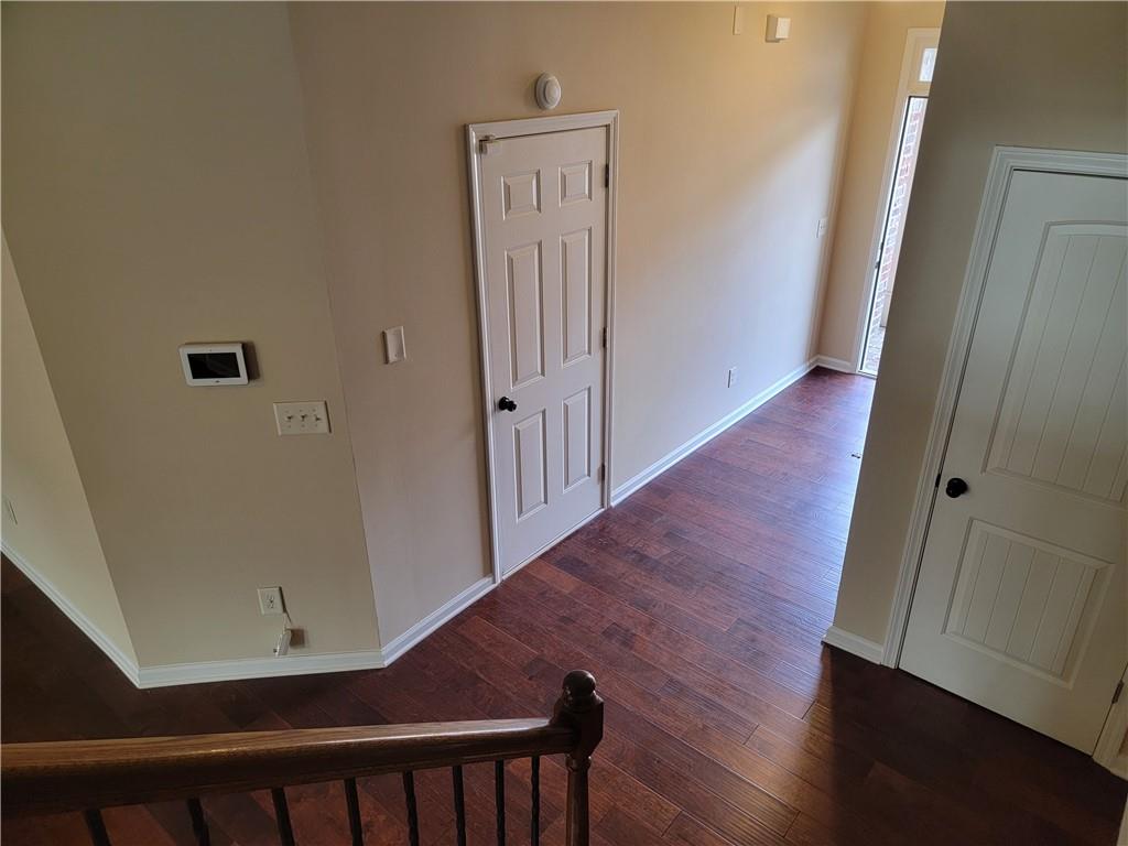 2707 Morgan Glen Road Northeast Buford, GA 30519 - Photo 24 of 24 a view of a hallway with wooden floor
