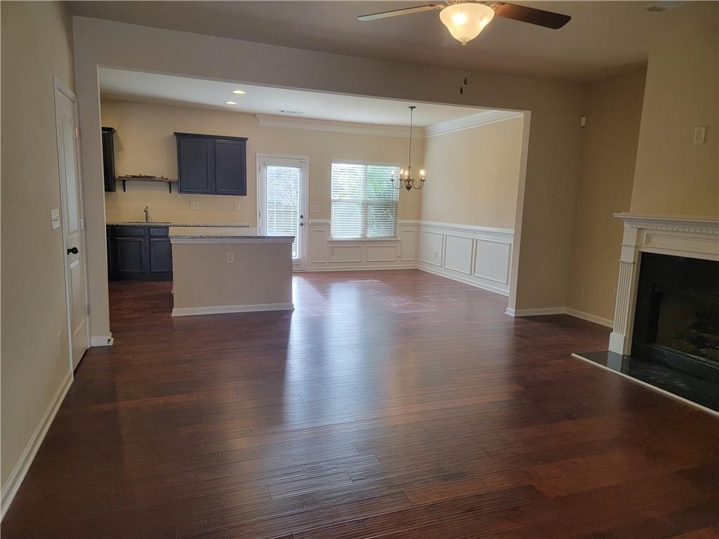2707 Morgan Glen Road Northeast Buford, GA 30519 - Photo 6 of 24 a view of a kitchen with wooden floor and a kitchen