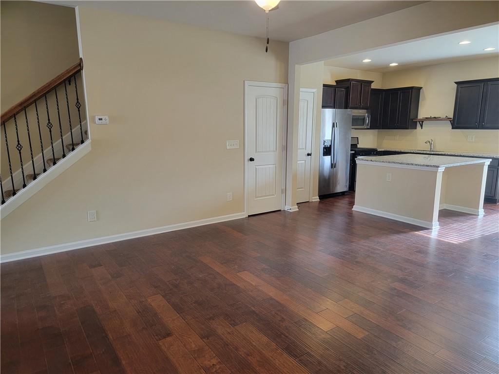 2707 Morgan Glen Road Northeast Buford, GA 30519 - Photo 8 of 24 a view of kitchen with wooden floor and electronic appliances