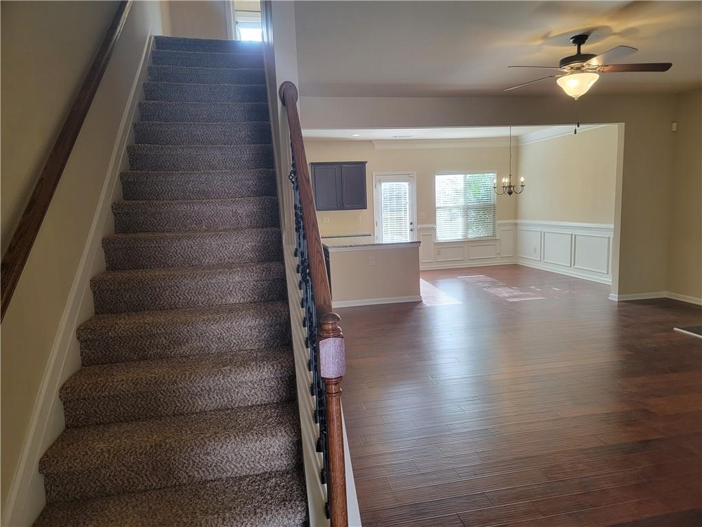 2707 Morgan Glen Road Northeast Buford, GA 30519 - Photo 9 of 24 a view of an empty room with wooden floor and a window