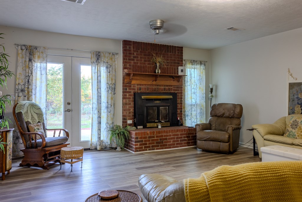 196 Russell Williams Road Eufaula, AL 36027 - Photo 13 of 30 a living room with furniture or fireplace and a wooden floor