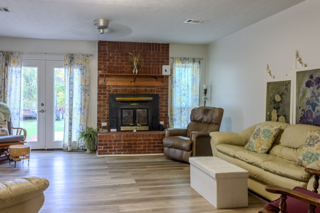 196 Russell Williams Road Eufaula, AL 36027 - Photo 14 of 30 a living room with furniture and a fireplace