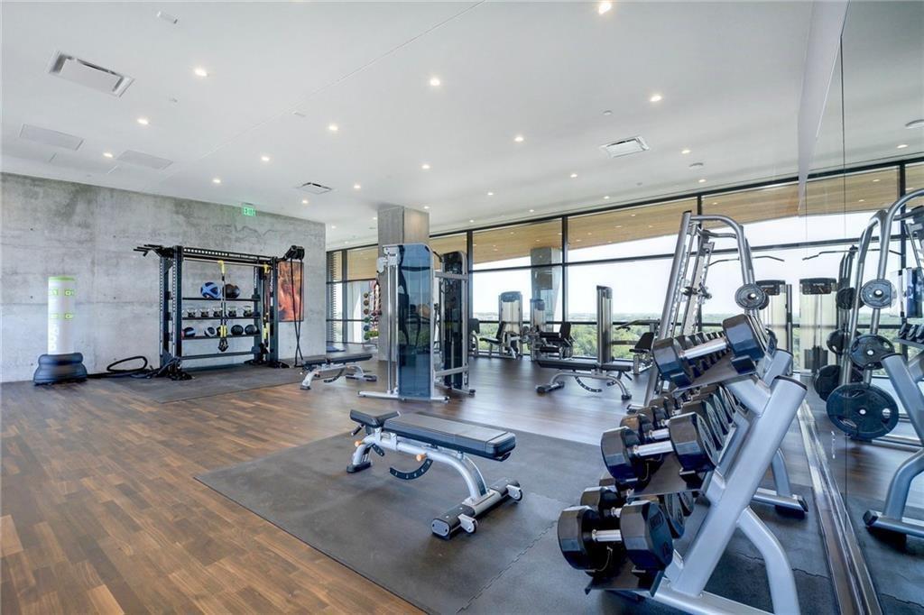 70 Rainey Street, Unit 1409 Austin, TX 78701 - Photo 37 of 38 Gym featuring expansive windows