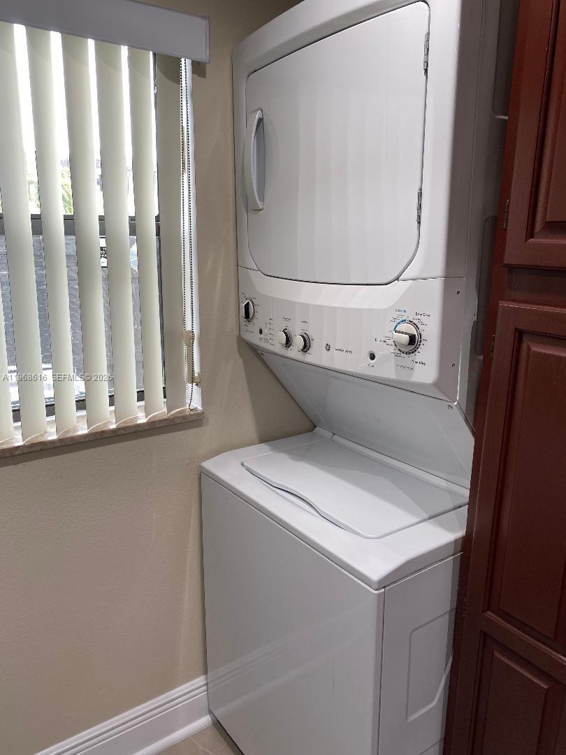 11339 Southwest 71st Lane Miami, FL 33173 - Photo 12 of 19 a utility room with dryer and washer