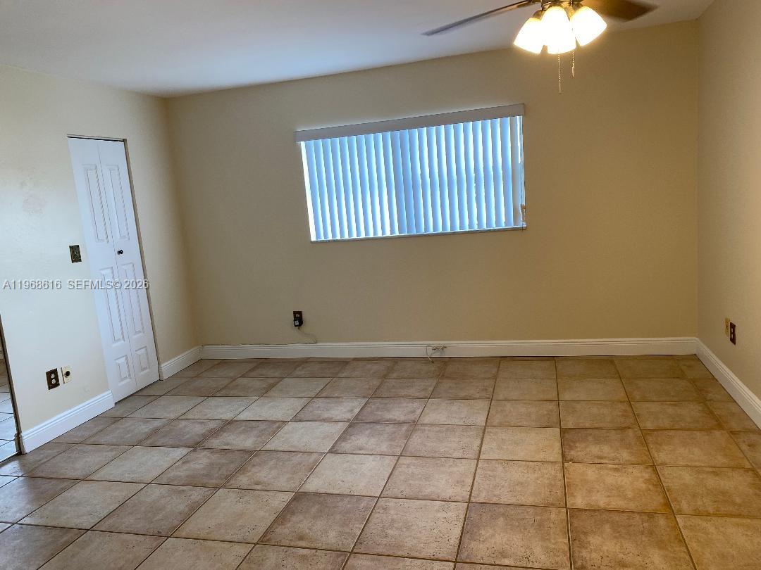 11339 Southwest 71st Lane Miami, FL 33173 - Photo 13 of 19 a view of an empty room and window