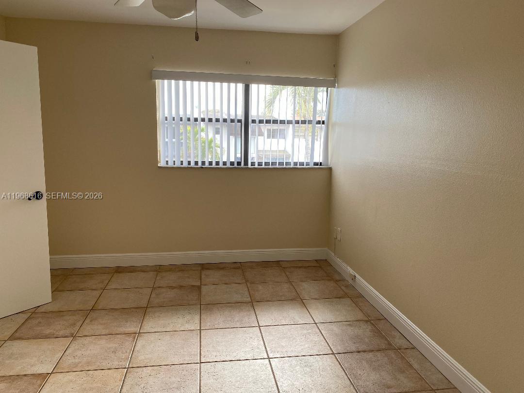 11339 Southwest 71st Lane Miami, FL 33173 - Photo 15 of 19 a view of a livingroom with a window