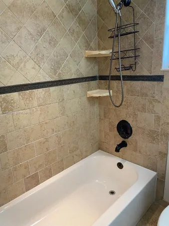 a bathroom with a bath tub