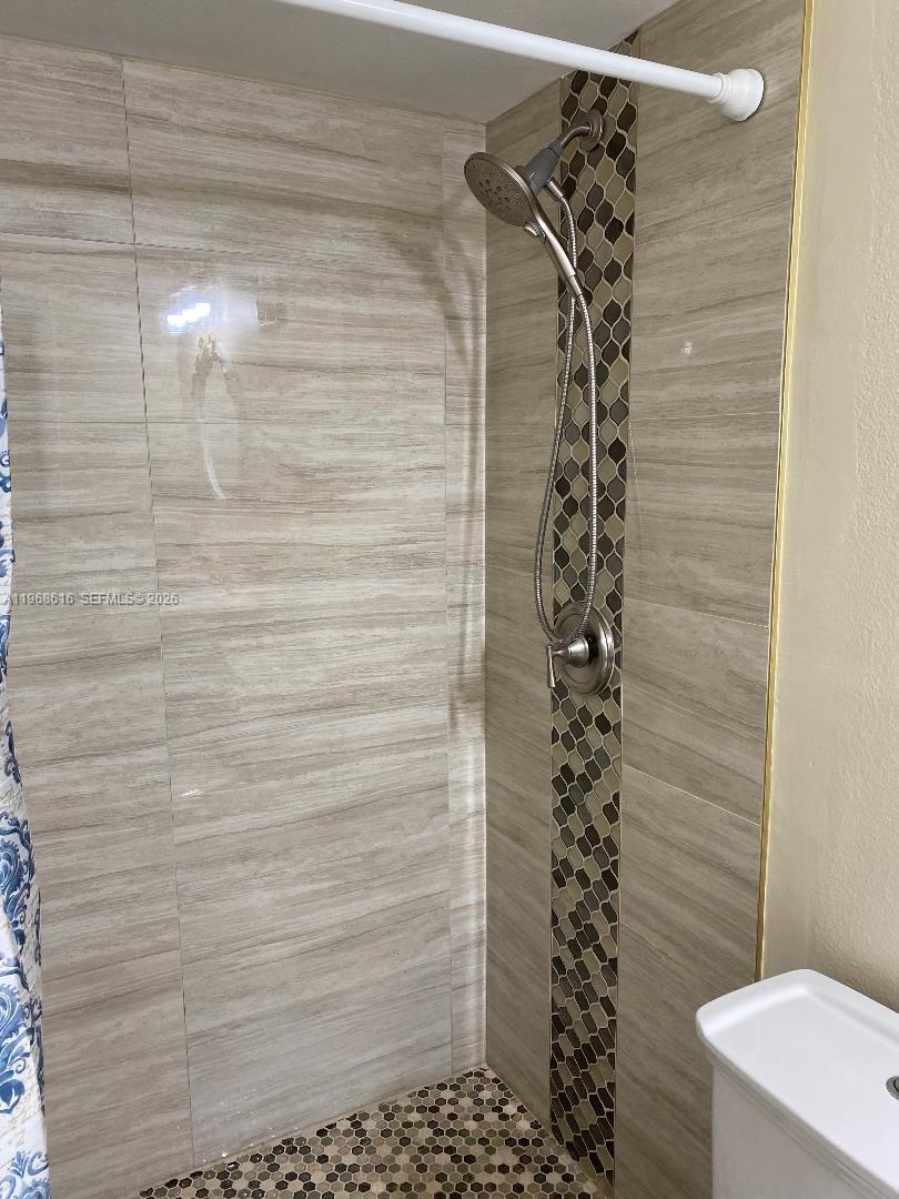 11339 Southwest 71st Lane Miami, FL 33173 - Photo 8 of 19 a bathroom with a shower