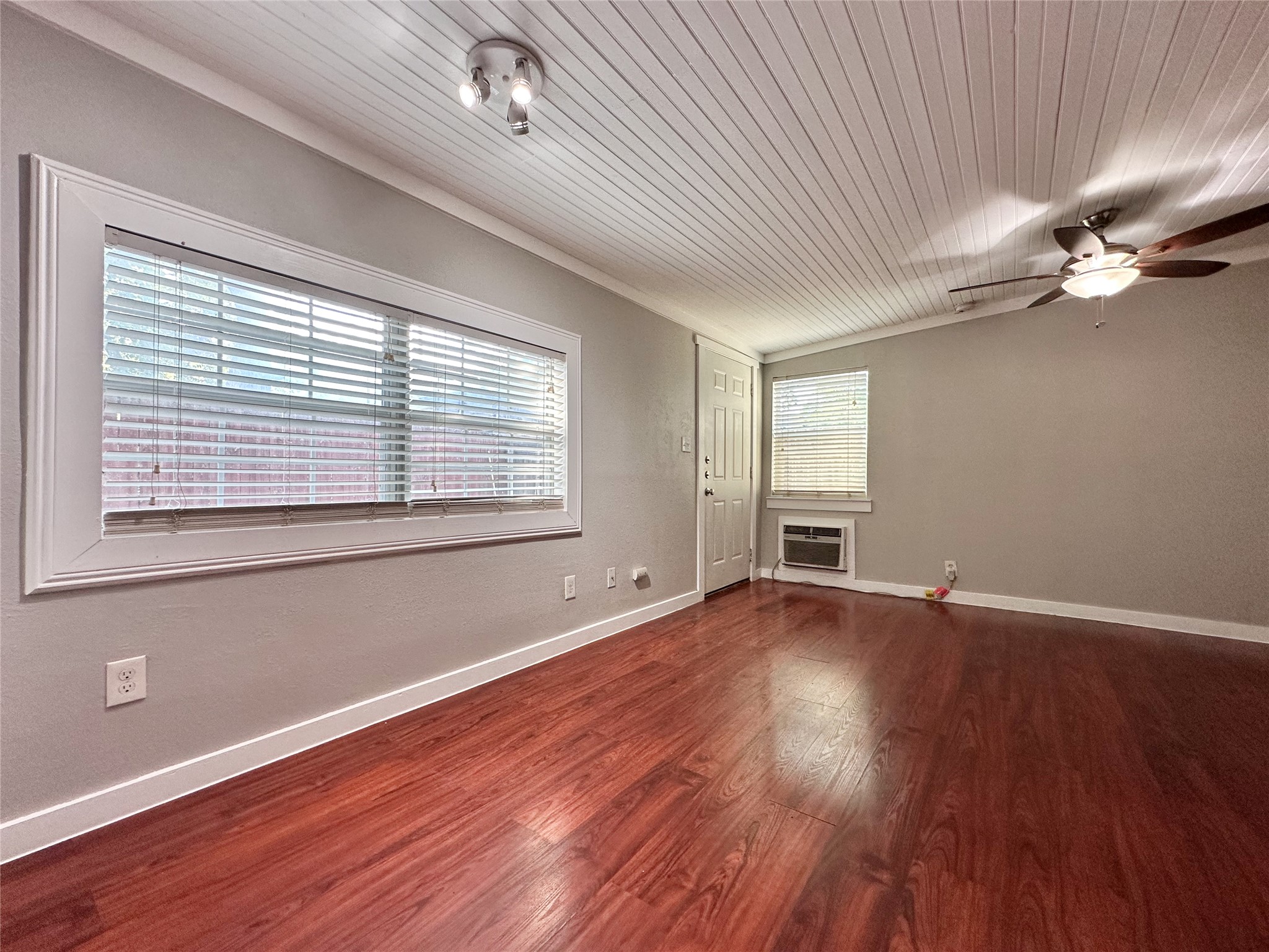 2103 East 16th Street, Unit ANNEX Austin, TX 78702 - Photo 4 of 23 a view of an empty room with wooden floor and a window