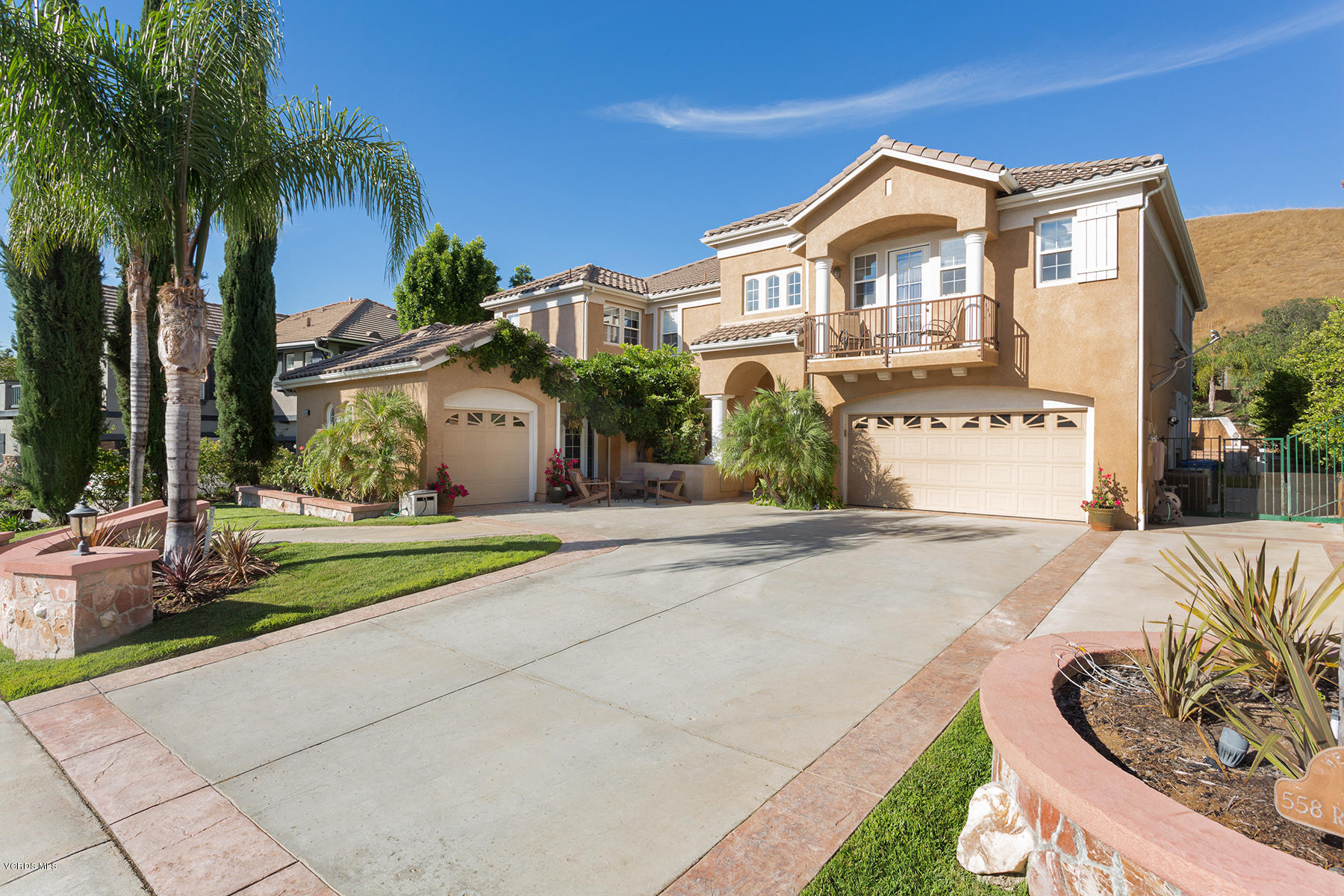 558 Rustic Hills Drive Simi Valley, CA 93065 - Photo 2 of 50 a front view of a house with garden