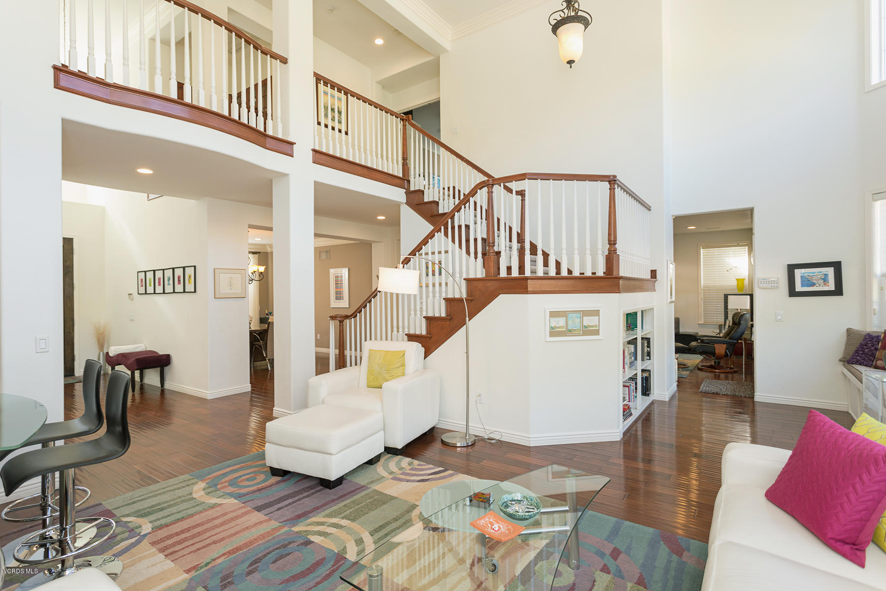 558 Rustic Hills Drive Simi Valley, CA 93065 - Photo 11 of 50 a living room with a couch and a dining table