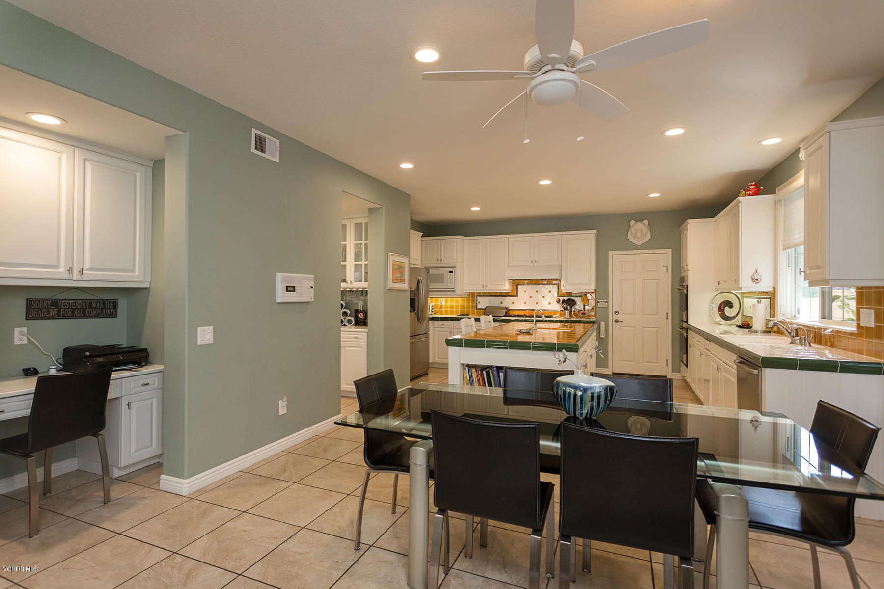 558 Rustic Hills Drive Simi Valley, CA 93065 - Photo 14 of 50 a kitchen with a dining table chairs and view of living room