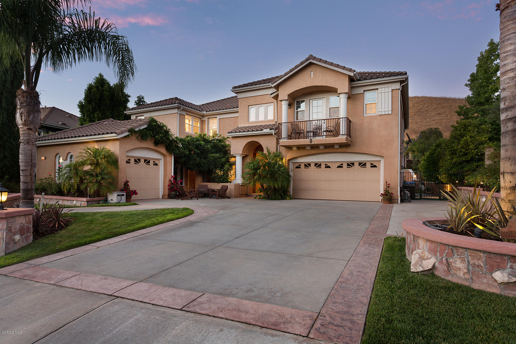 558 Rustic Hills Drive Simi Valley, CA 93065 - Photo 3 of 50 a front view of a house with a yard and garage