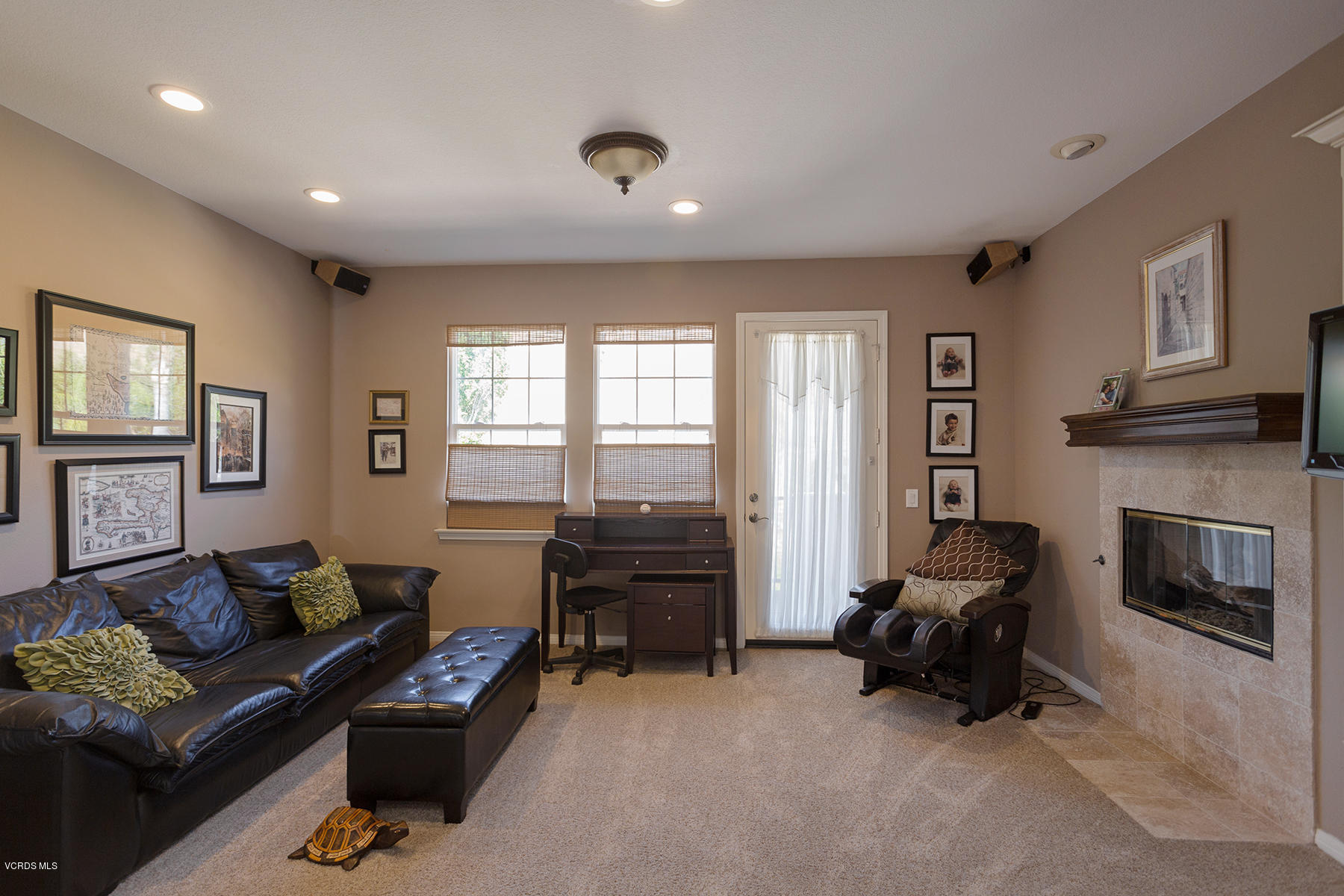 558 Rustic Hills Drive Simi Valley, CA 93065 - Photo 26 of 50 a living room with furniture and a fireplace