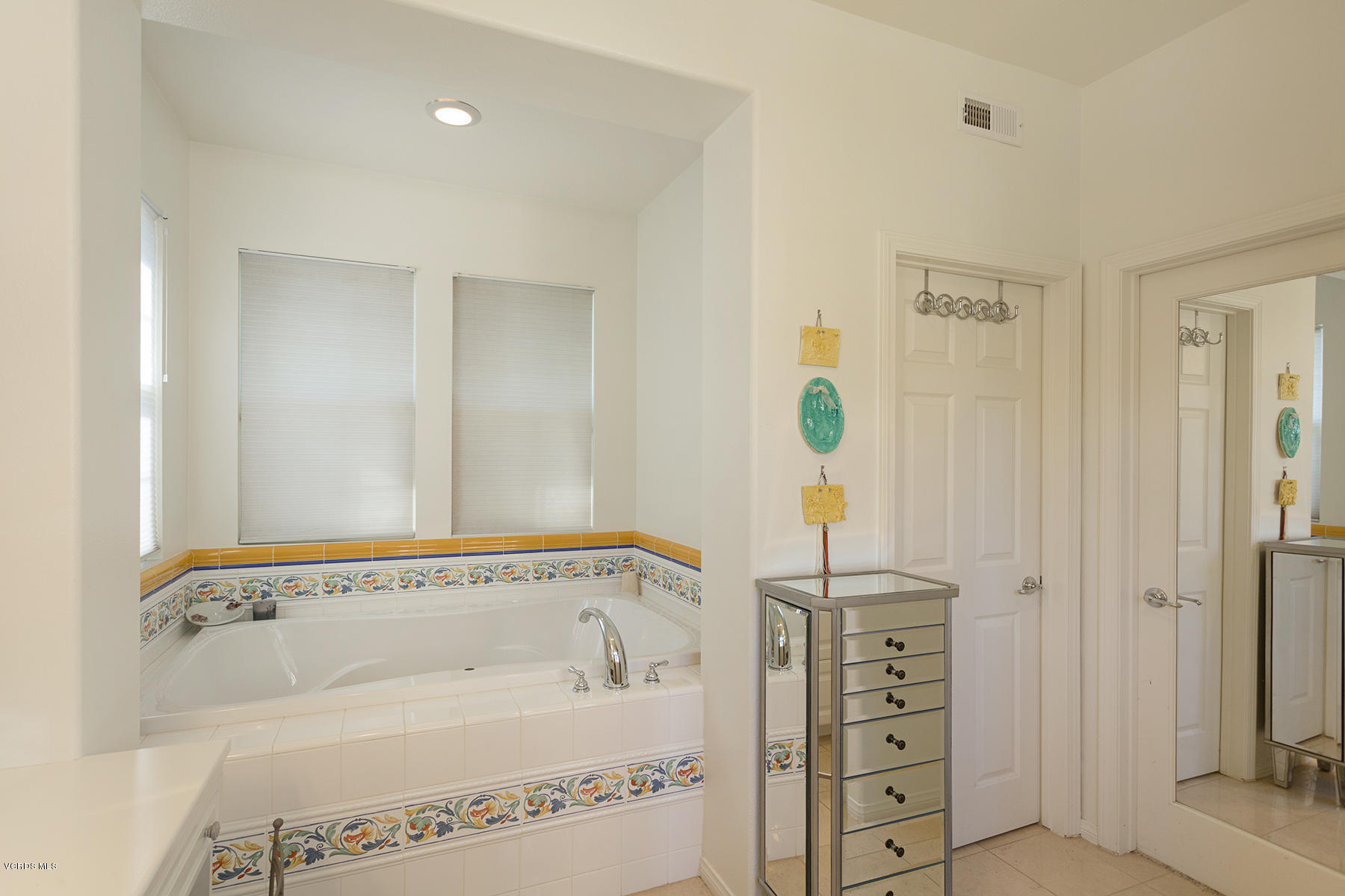 558 Rustic Hills Drive Simi Valley, CA 93065 - Photo 32 of 50 a bathroom with a bathtub and shower