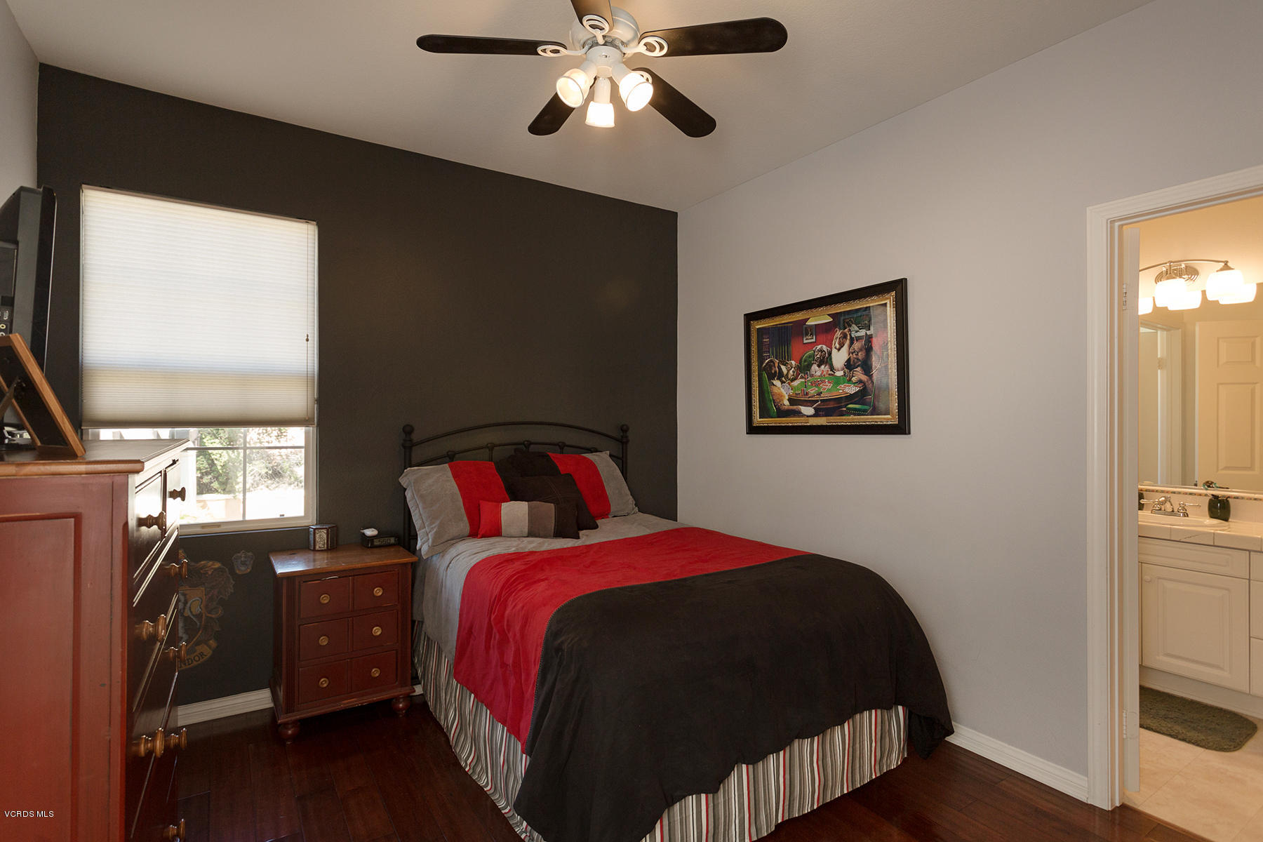 558 Rustic Hills Drive Simi Valley, CA 93065 - Photo 36 of 50 a bedroom with a bed and wooden floor