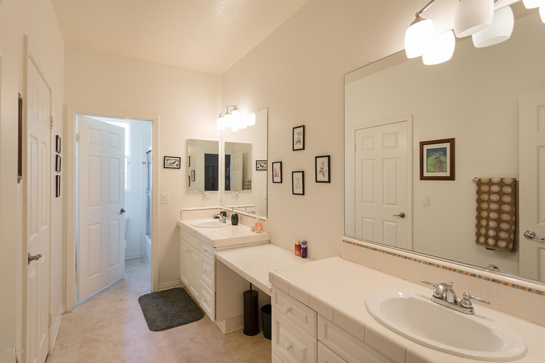 558 Rustic Hills Drive Simi Valley, CA 93065 - Photo 37 of 50 a spacious bathroom with a double vanity sink a mirror and a