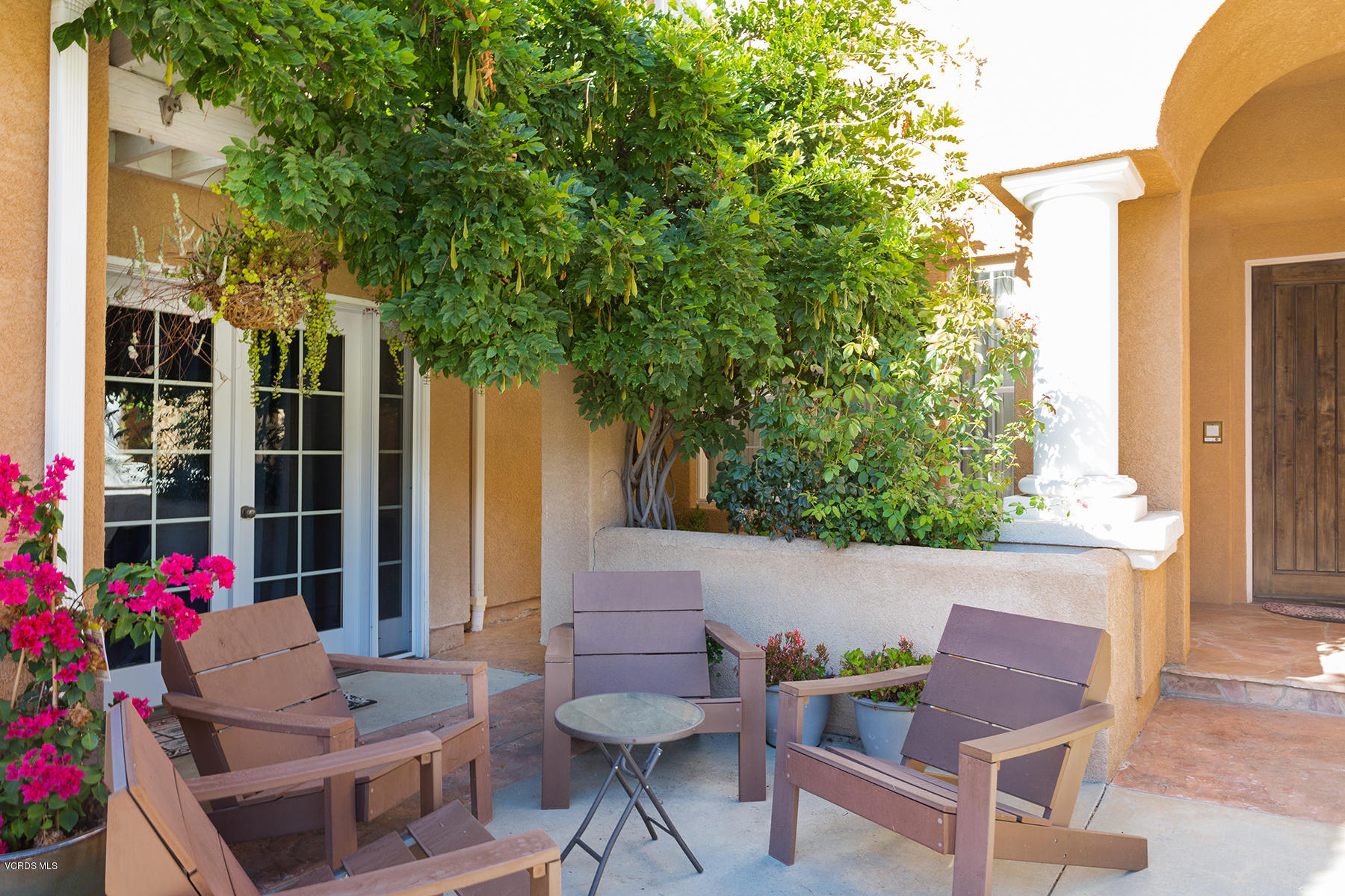 558 Rustic Hills Drive Simi Valley, CA 93065 - Photo 5 of 50 a backyard of a house with table and chairs