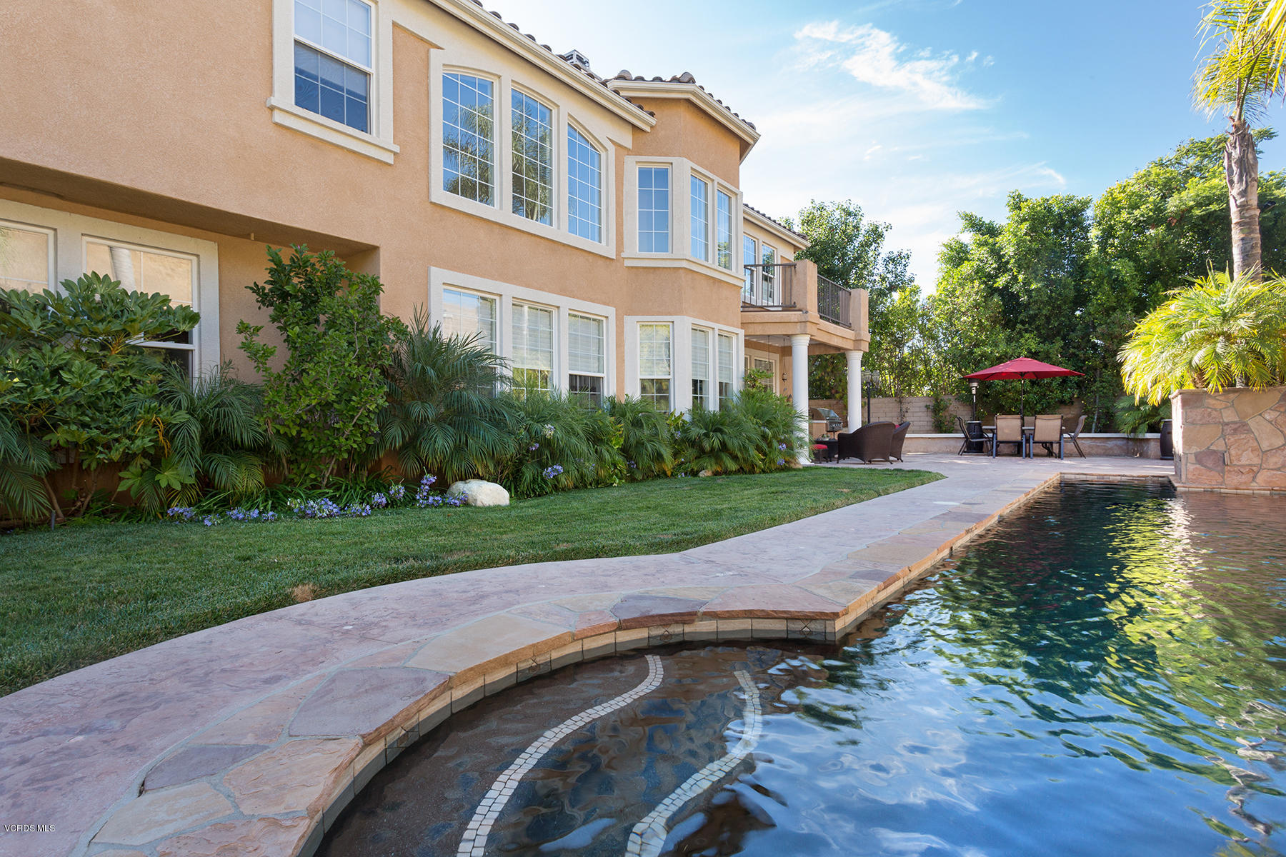 558 Rustic Hills Drive Simi Valley, CA 93065 - Photo 45 of 50 a view of a patio with table and chairs and potted plants